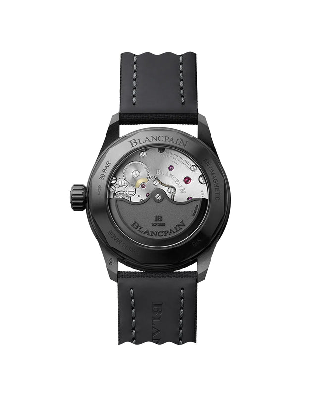 The back view of the Blancpain Bathyscaphe highlights its mechanical movement and 120-hour power reserve, visible through a transparent case back, paired with a black leather strap featuring white stitching.