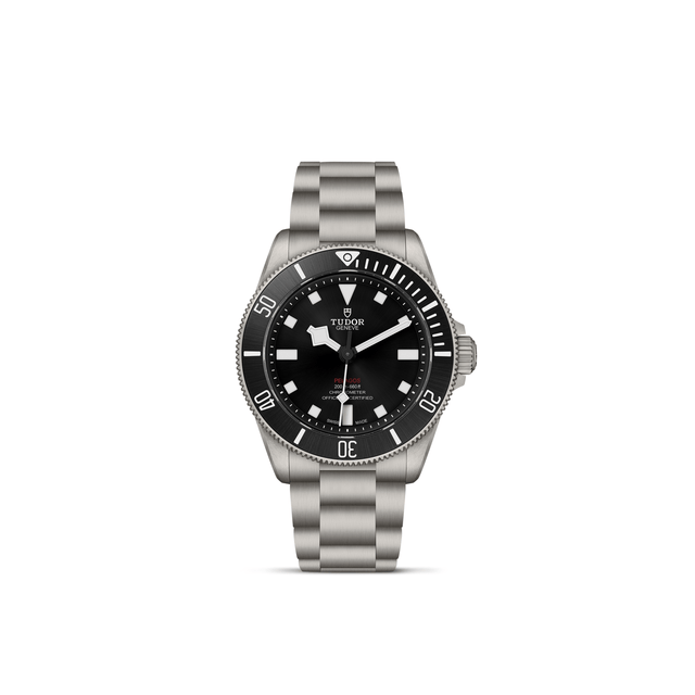 The TUDOR Pelagos 39 wristwatch by TUDOR features stainless steel construction, a black unidirectional rotating bezel and dial, white hour markers, and a metal bracelet, displayed against a plain white background.